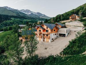 an aerial view of a house in the mountains at Les chalets Super Geants in Saint-François-Longchamp