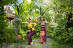 two women are standing in a garden at Edge of Ubud by GenuineHost in Ubud