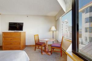 a bedroom with a bed and a table and chairs at GL306 Butte Gem in Crested Butte
