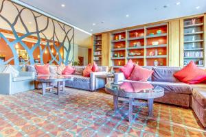 a living room with couches and tables at Riverfront Escape #320 in Avon