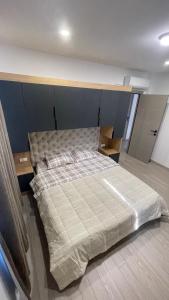 a bedroom with a large bed in a room at SunVillaTuzi in Tuzi