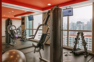 a gym with tread machines and a view of the city at Tryp by Wyndham Panama Centro in Panama City