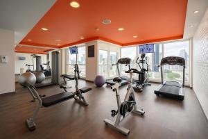 a gym with several treadmills and exercise bikes at Tryp by Wyndham Panama Centro in Panama City