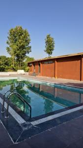 a swimming pool with a ramp in front of a building at Nal Village Resort By Explore With Nirav in Rupāwati