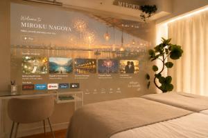a bedroom with a wall with a poster of a mufro network at Miroku Nagoya in Minami-sotoborichō