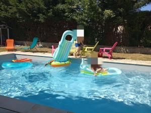 a young child playing in a swimming pool on at Éclipse in Vénissieux