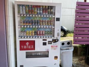 a vending machine filled with bottles of soda at ホテルシルクロード ＡｄｕｌｔＯｎｌｙ in Hiroshima +18 photos
