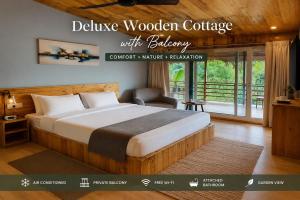 a hotel room with a bed and a balcony at Basera At Palolem in Canacona