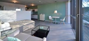 a bedroom with a bed and a table and chairs at LOFT Apartments in Schorndorf