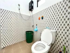 a bathroom with a toilet and a shower at MP Villa Boulvard 43 Malang in Blimbing +32 photos