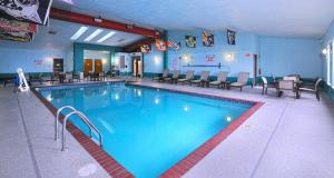 a large swimming pool in a hotel room at Quality Inn Stadium Area Green Bay Stadium in Green Bay