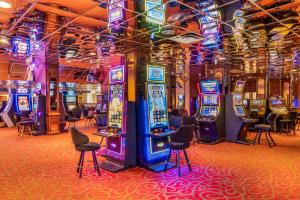 a room filled with lots of slot machines at The Federal Hotel Downtown Carson City, an Ascend Collection Hotel in Carson City