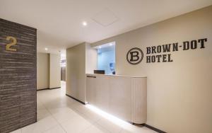 a hospital lobby with a brown dot sign on the wall at Daegu Brown Dot Hotel Kyungpook National University in Daegu