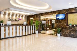 a lobby of a building with a reception desk at The Dwelling Inn in Greater Noida