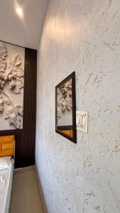 a bathroom with a mirror on a wall at Kanak Bihari Enclave in Ayodhya