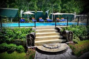 a set of stairs next to a swimming pool at The Kings Villa in Kandy