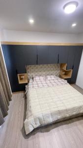 a bedroom with a bed with two drawers on it at SunVillaTuzi in Tuzi