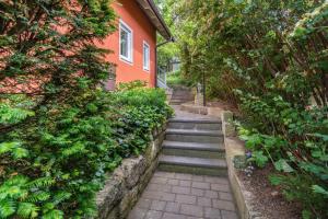 a set of stairs leading up to a house at Sonnengelb - Fulgenhaus in Klein Bollhagen