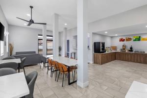 a dining room and kitchen with a table and chairs at Quality Inn Ponca City in Ponca City