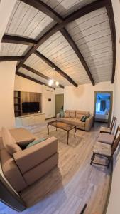 a large living room with couches and a table at Oborri Shkodran Boutique Hotel in Shkodër