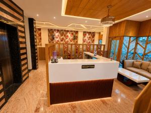 a bar in a tasting room with a couch at Hotel The Royal Barbariq in Khātu +70 photos