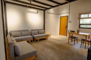 a living room with a couch and a table at Hillcrest Dawn, Bentong in Bentong