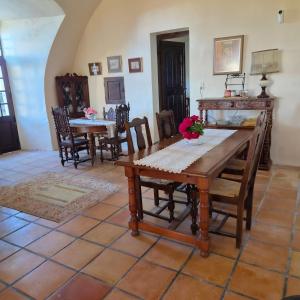 a dining room with a table and chairs at Château de Trévien in Trévien