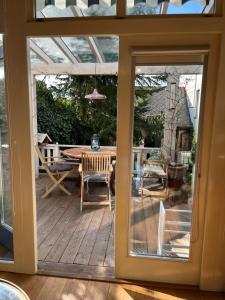 an open door to a patio with a table and chairs at Staré časy in Chotěboř