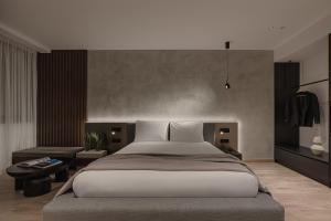 a bedroom with a large bed and a table at Union43 Ioannina in Ioannina