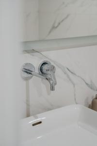 a sink with a faucet in a bathroom at K16 Apartments in Krakow