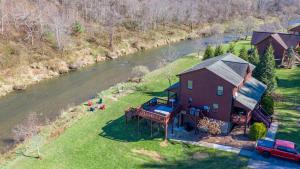 an aerial view of a house next to a river at Riverbend Retreat in Todd