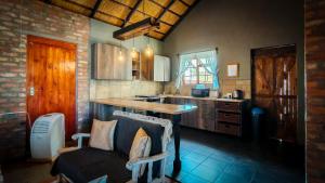 a kitchen with a counter and a table in it at Studios @ Delver in Parys