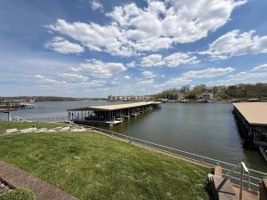 a view of a river with a dock on the water at LOTO fun at 21 Lakeview Condo in Osage Beach