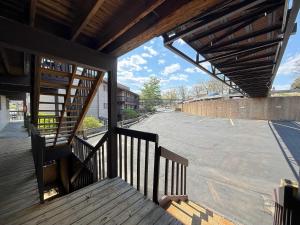 an outside view of a building with a wooden staircase at LOTO fun at 21 Lakeview Condo in Osage Beach