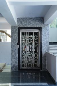 a door with a metal gate on a building at Hotel Vijaya Comfort in Hyderabad