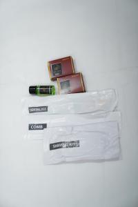 a group of cosmetics sitting on a white table at Hotel Vijaya Comfort in Hyderabad +7 photos