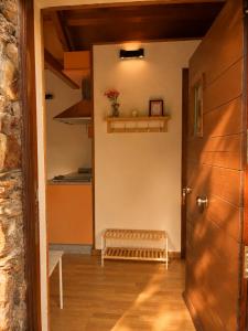 a hallway with a door and a bench at Casa das Minas in Zobra +29 photos