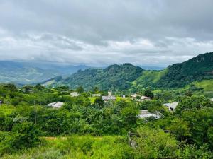 a view of a village in the mountains at N4 Rest Hanthana in Etulgama