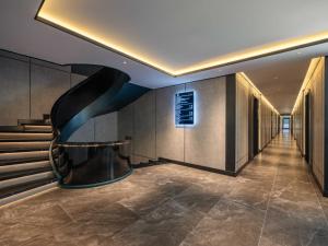 a hallway of a building with a staircase at Victorious Cruise Ha Long Bay in Ha Long