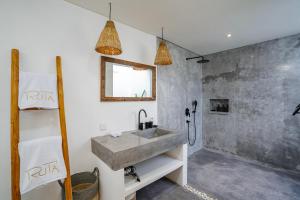 a bathroom with a sink and a shower at Villa Ruta I - Sumptuous 2BR Luxury Villa next to Luna Beach Club and Nyanyi Beach in Tanah Lot +20 photos