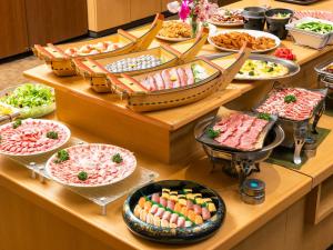 a buffet line with many different types of food at Hotel Kirishima Castle in Kirishima +32 photos