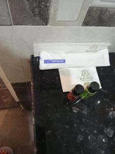 two bottles of wine sitting on top of a table at The Kalindi Hotel and Resort in Hamīrpur