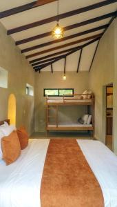 a bedroom with a large white bed in a room at Mystic Beach Resort in Guachaca +60 photos