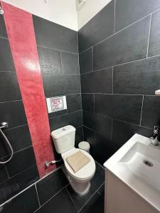 a bathroom with a white toilet and a sink at Kova2 in Alexandroupoli +22 photos