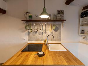 a kitchen with a sink and a counter top at La Casetta nel Borgo in Montalbano Elicona +31 photos
