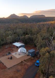 an aerial view of a dome tent and a car at Bubble Hotel in Coonabarabran