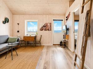 a living room with a couch and a horse head on the wall at Charming cabin with a view in Gol