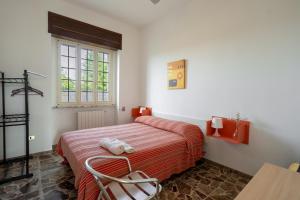 a bedroom with a bed and a window at Casa Libeccio in Gagliano del Capo