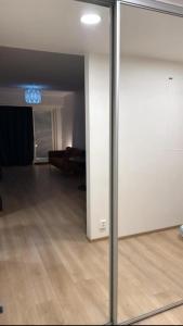 a view of a living room through a glass door at Marina in Tampere