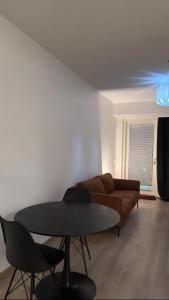 a living room with a table and a couch at Marina in Tampere